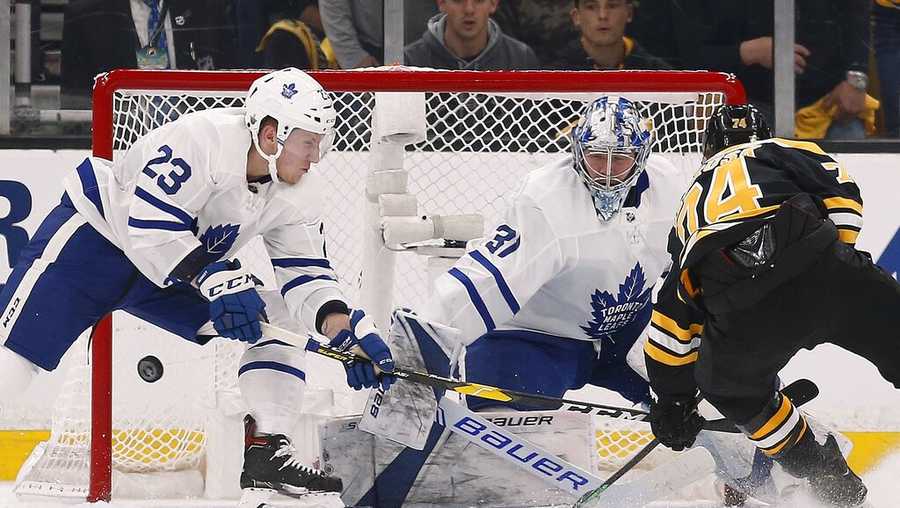 Toronto Maple Leafs' Frederik Andersen (31) blocks a shot by Boston Bruins' Jake DeBrusk (74) during the first period in Game 5 of an NHL hockey first-round playoff series in Boston, Friday, April 19, 2019. (AP Photo/Michael Dwyer)