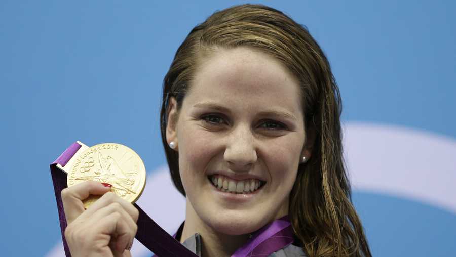 FILE - In this July 30, 2012, file photo, United States&apos; Missy Franklin poses with her gold medal for the women&apos;s 100-meter backstroke swimming final at the Aquatics Centre in the Olympic Park during the 2012 Summer Olympics in London. Missy Franklin is so upbeat, so full of energy, so dang positive all the time, it&apos;s hard to imagine her ever going to a dark place. (AP Photo/Michael Sohn, File)