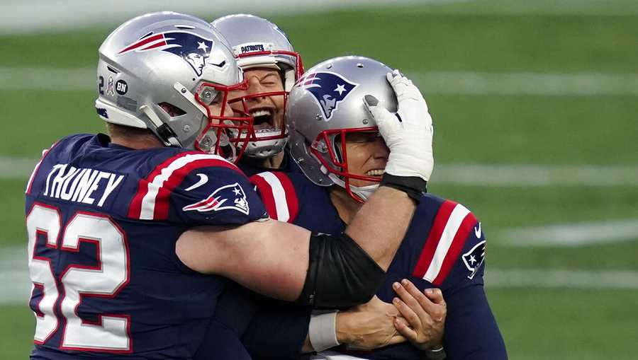New England Patriots kicker Nick Folk celebrates his game-winning field goal with lineman Joe Thuney, left, and holder Jake Bailey, rear, as time expires in an NFL football game against the Arizona Cardinals, Sunday, Nov. 29, 2020, in Foxborough, Mass. (AP Photo/Elise Amendola)