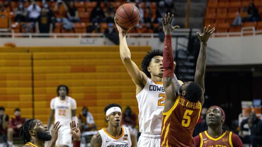 Oklahoma State guard Cade Cunningham (2) shoots over Iowa State guard Jalen Coleman-Lands (5) during the second half of the NCAA college basketball game against in Stillwater, Okla., Tuesday, Feb. 16, 2021. (AP Photo/Mitch Alcala)