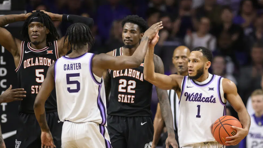 Kansas State guard Markquis Nowell (1) is congratulated by Kansas State guard Cam Carter (5) after hitting a free throw near the end of their game against Oklahoma State during the second half of an NCAA college basketball game in Manhattan, Kan., Tuesday, Jan. 10, 2023. (AP Photo/Reed Hoffmann)