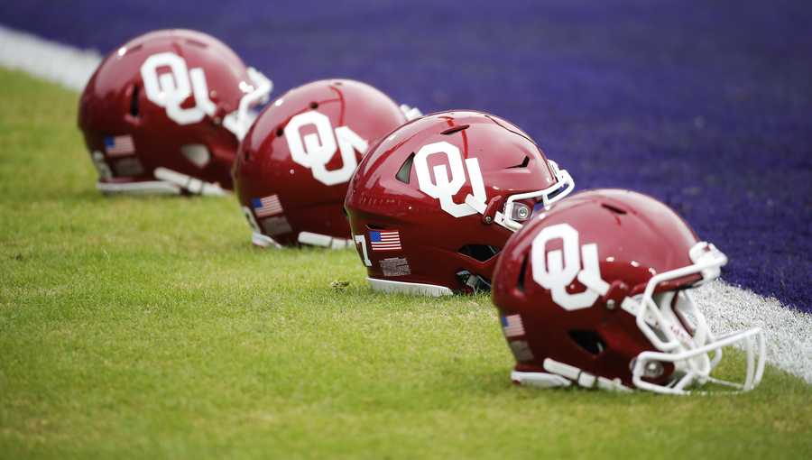 AP Images: Oklahoma football helmets before the first half of an NCAA college football game against TCU, Saturday, Oct. 20, 2018, in Fort Worth, Texas. Oklahoma won 52-27. (AP Photo/Brandon Wade)