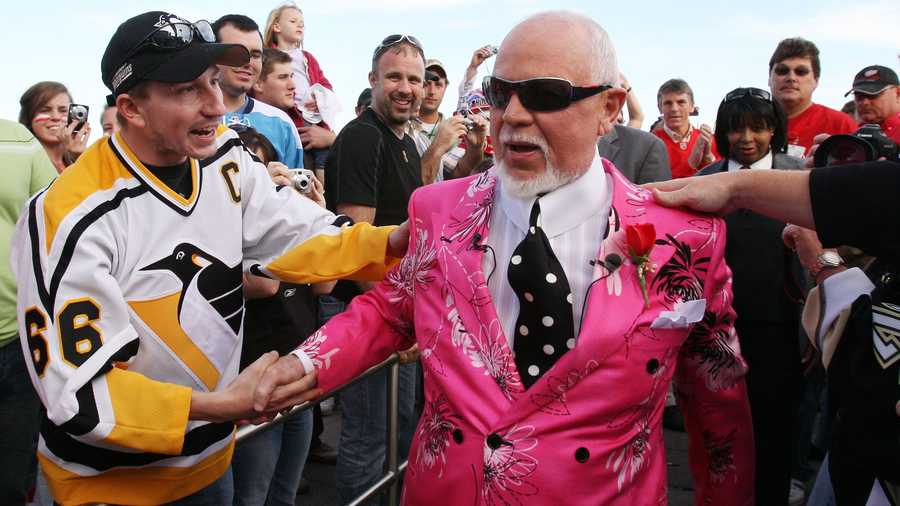 Don Cherry, announcer on CBC's "Hockey Night in Canada," is greeted by fans as he arrives for Game 2 of the NHL hockey Stanley Cup finals between the Pittsburgh Penguins and the Detroit Red Wings in Detroit, Sunday, May 31, 2009. (AP Photo/Carlos Osorio)
