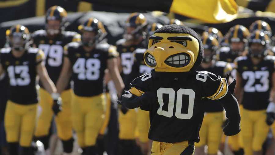 the iowa hawkeyes mascot runs onto the field, leading the team before the start of an ncaa college football game against colorado state, saturday, sept. 25, 2021, in iowa city, iowa. (ap photo/ron johnson)