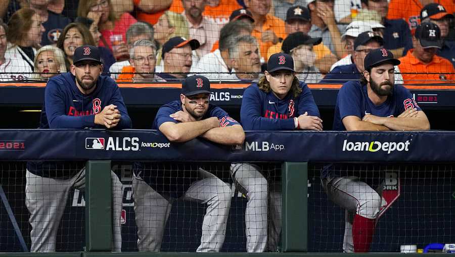 Members of the Boston Red Sox watch during the eighth inning in Game 6 of baseball&apos;s American League Championship Series against the Houston Astros Friday, Oct. 22, 2021, in Houston. (AP Photo/David J. Phillip)