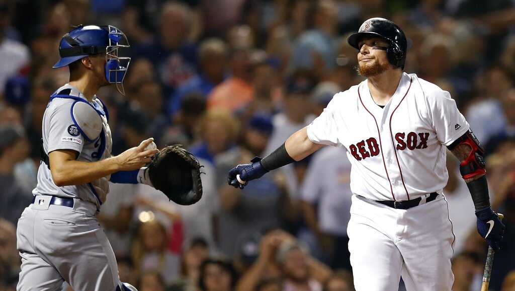 Brock Holt of the Boston Red Sox reacts after hitting an RBI