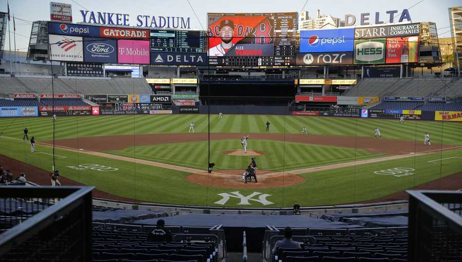 The stadium is almost totally empty during the second inning of a baseball game between the New York Yankees and the Boston Red Sox at Yankee Stadium, Friday, July 31, 2020, in New York. (AP Photo/Seth Wenig)