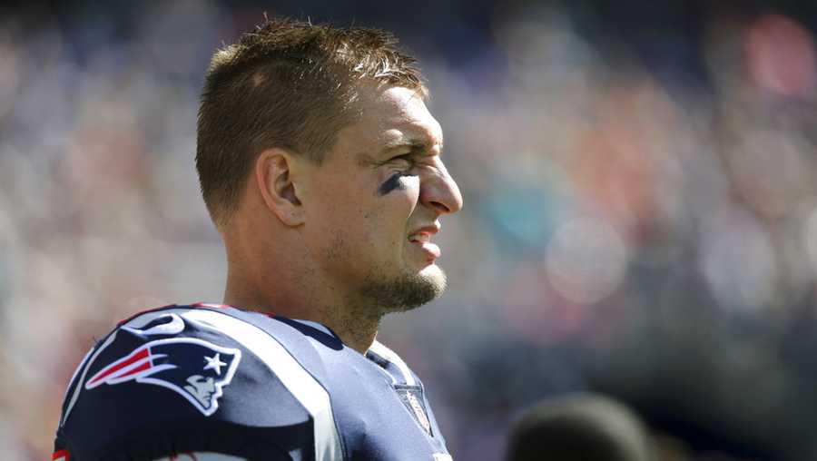 New England Patriots tight end Rob Gronkowski watches from the sideline during the first half of an NFL football game against the Miami Dolphins, Sunday, Sept. 30, 2018, in Foxborough, Mass. (AP Photo/Elise Amendola)