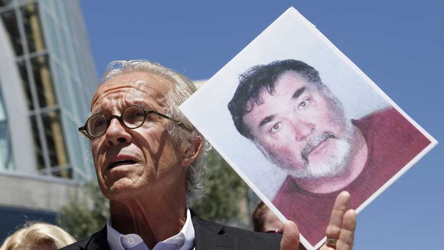FILE - Attorney Jeff Anderson holds up a photo of former priest Stephen Kiesle at a news conference in Oakland, Calif., Wednesday, Aug. 18, 2010. The family of the late Jim Bartko, who said he was molested as a child by Kiesle, has filed a lawsuit against the Roman Catholic church under a new California law that allows family members of sex abuse victims to bring lawsuits after their deaths. The family of Bartko filed the suit in January 2022 in Alameda County Superior Court against the Diocese of Oakland. (AP Photo/Jeff Chiu, File)