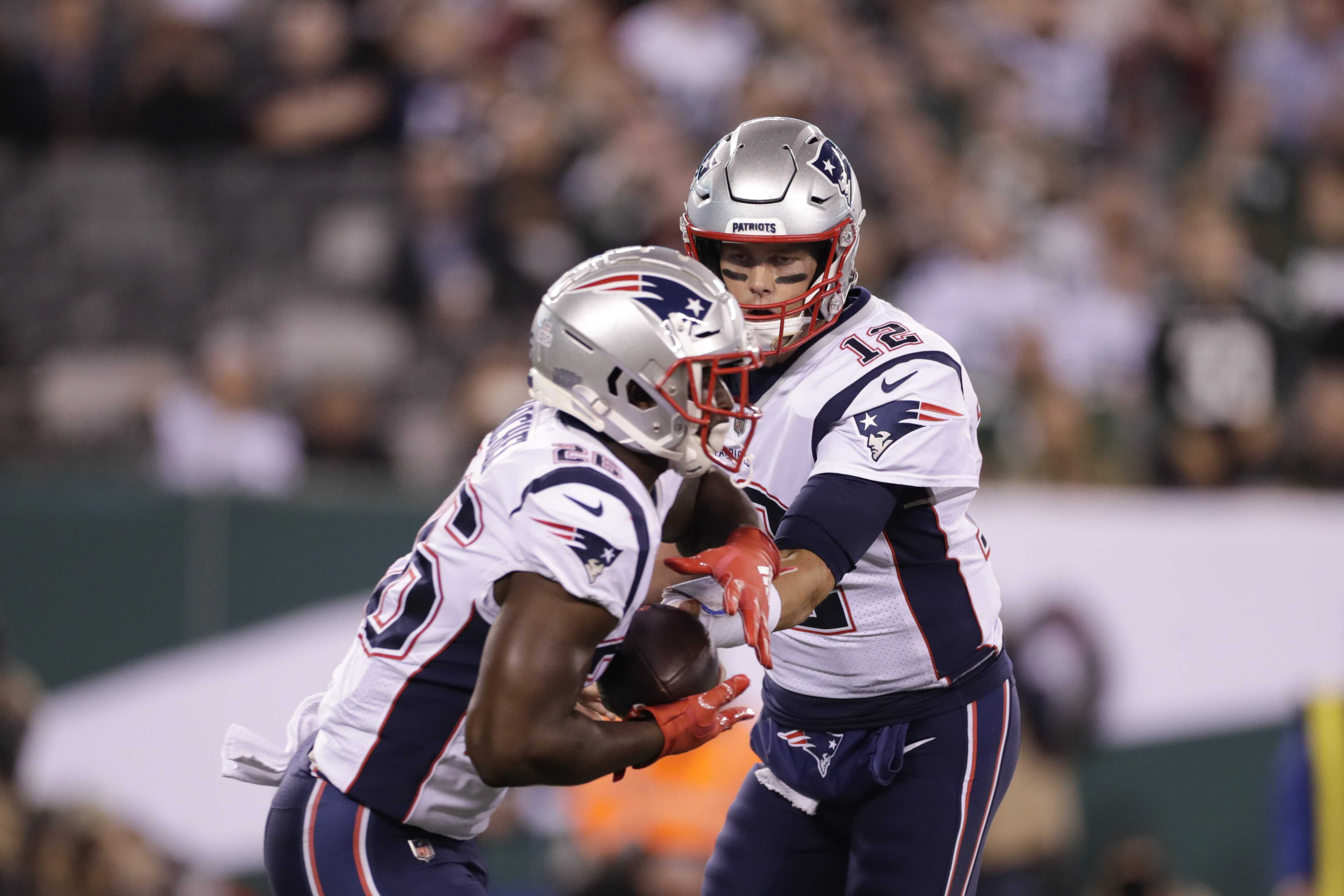 New England Patriots Tom Brady throws a pass in the first half against the  New York Jets in week 12 of the NFL at MetLife Stadium in East Rutherford,  New Jersey on