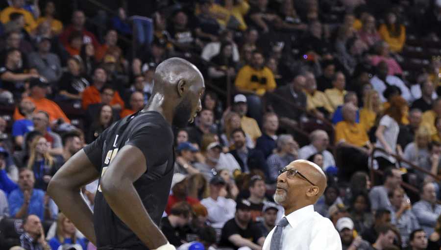 Tacko Fall's enormous shoe looks even more absurd in the hands of an  8-year-old boy