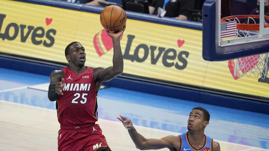 Miami Heat guard Kendrick Nunn (25) goes up for a shot in front of Oklahoma City Thunder guard Theo Maledon (11) in the second half of an NBA basketball game Monday, Feb. 22, 2021, in Oklahoma City. (AP Photo/Sue Ogrocki)