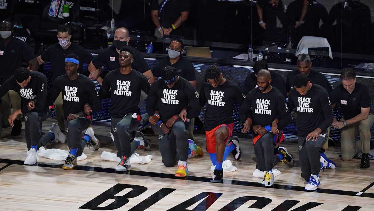 Thunder players kneel during national anthem before resuming NBA season