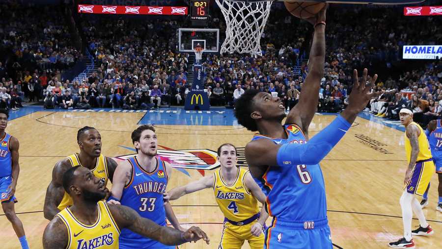 Oklahoma City Thunder guard Hamidou Diallo (6) shoots in front of Los Angeles Lakers forward LeBron James (23) and guard Alex Caruso (4) during the fist half of an NBA basketball game Friday, Nov. 22, 2019, in Oklahoma City. (AP Photo/Sue Ogrocki)