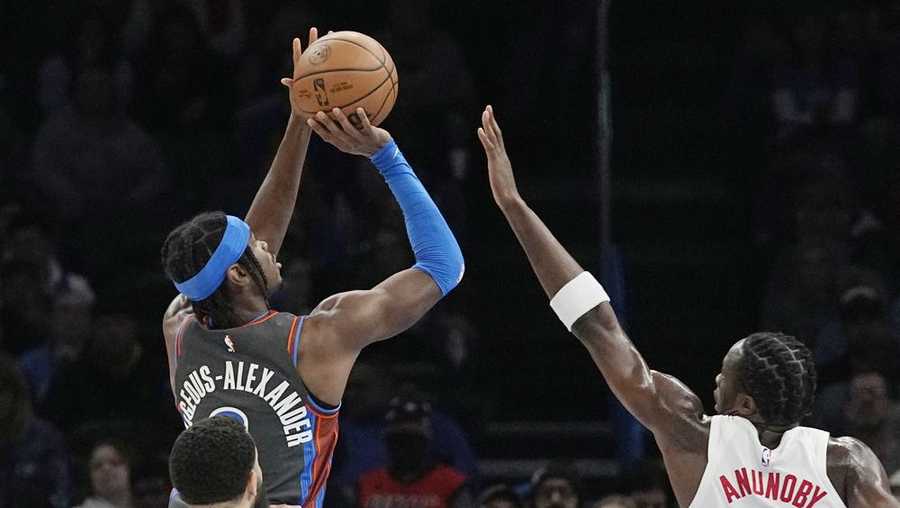 Oklahoma City Thunder guard Shai Gilgeous-Alexander, top left, shoots in front of Toronto Raptors guard Fred VanVleet, bottom left, and forward O.G. Anunoby (3) in the first half of an NBA basketball game Friday, Nov. 11, 2022, in Oklahoma City. (AP Photo/Sue Ogrocki)