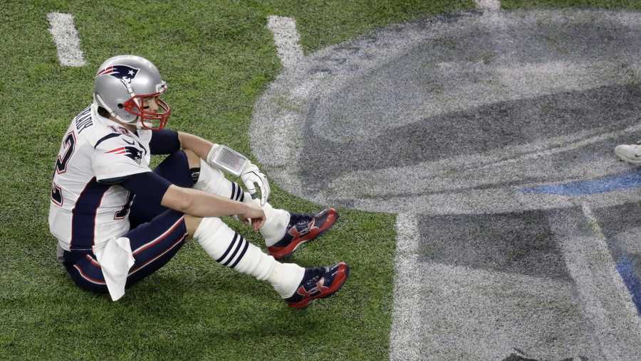 New England Patriots quarterback Tom Brady sits on the field after fumbling against the Philadelphia Eagles during the second half of the NFL Super Bowl 52 football game Sunday, Feb. 4, 2018, in Minneapolis. (AP Photo/Eric Gay)