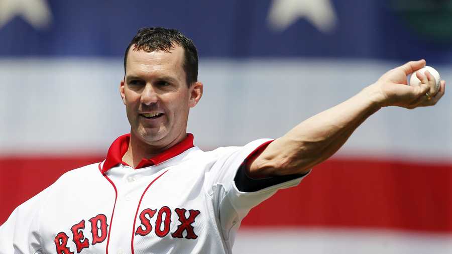Former Boston Red Sox's Trot Nixon throws out the first pitch before a baseball game between the Red Sox and the Detroit Tigers in Boston, Monday, May 28, 2012.