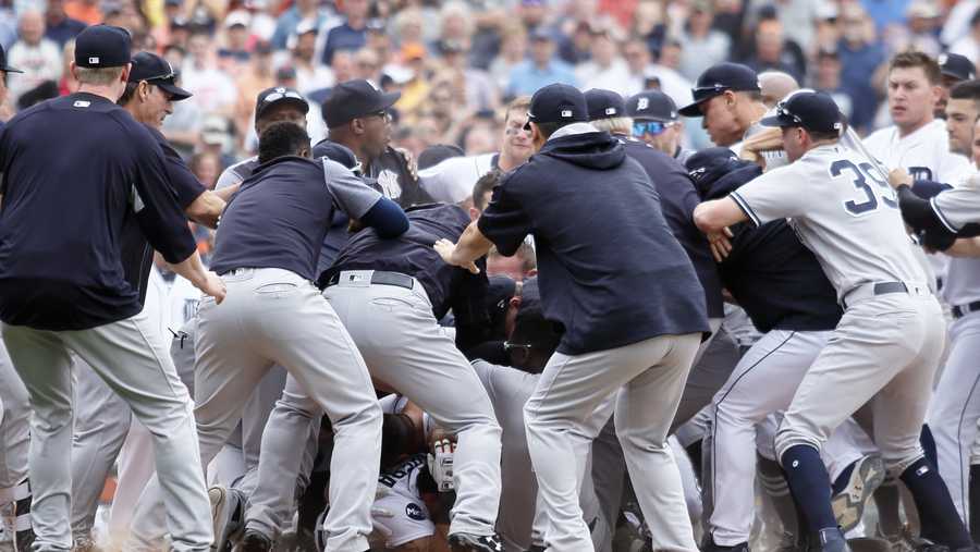 Detroit Tigers' Miguel Cabrera is in the bottom of the pile as the New York Yankees fight with the Detroit Tigers during the sixth inning of a baseball game Thursday, Aug. 24, 2017, in Detroit. 