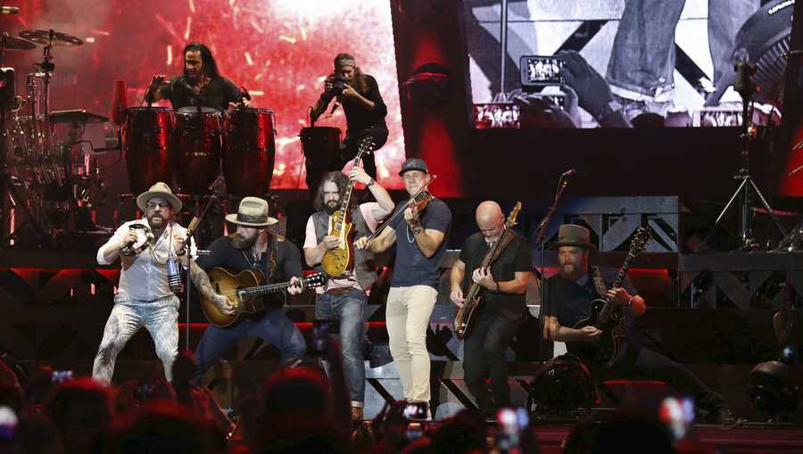 Zac Brown, Coy Bowles, Clay Cook, Daniel de los Reyes, Matt Mangano, Jimmy De Martini, Chris Fryar and John Driskell Hopkins with Zac Brown Band performs during the Down The Rabbit Hole Tour at SunTrust Park on Saturday, June 30, 2018, in Atlanta. (Photo by Robb Cohen/Invision/AP)