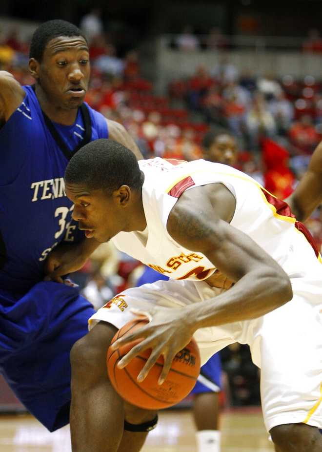Iowa State's Marquis Gilstrap, right, looks to drive around Tennessee State's Robert Covington during the first half of an NCAA college basketball game Tuesday, Nov. 24, 2009, in Ames, Iowa. (AP Photo/Charlie Neibergall)