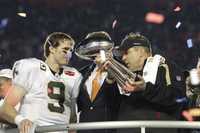 new orleans saints quarterback drew brees (9) is seen with new orleans saints head coach sean payton after the nfl super bowl xliv football game against the indianapolis colts in miami, sunday, feb. 7, 2010. the saints won 31-17. (ap photo/paul sancya)