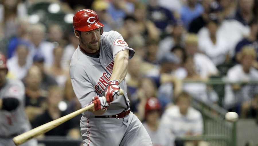 Cincinnati Reds' Scott Rolen hits an RBI single during the sixth inning of a baseball game against the Milwaukee Brewers on Tuesday, July 27, 2010, in Milwaukee. The hit was Rolen's fourth of the game. (AP Photo/Morry Gash)