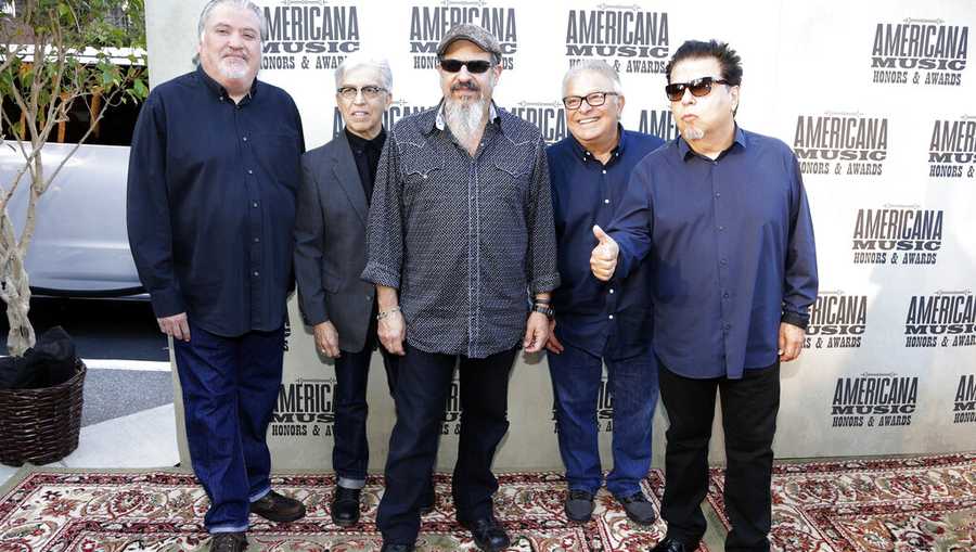 FILE - In this Sept. 16, 2015, file photo, the group Los Lobos, from left, David Hidalgo, Louie Perez, Steve Berlin, Conrad Lozano and Cesar Rosas arrive at the Americana Music Honors and Awards show in Nashville, Tenn. The band is being considered for induction next year in the Rock and Roll Hall of Fame. (AP Photo/Mark Zaleski, File)