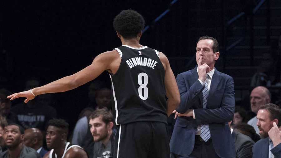 Brooklyn Nets guard Spencer Dinwiddie (8) talks to head coach Kenny Atkinson during the first half of an NBA basketball game against the Golden State Warriors, Sunday, Nov. 19, 2017, in New York. (AP Photo/Mary Altaffer)