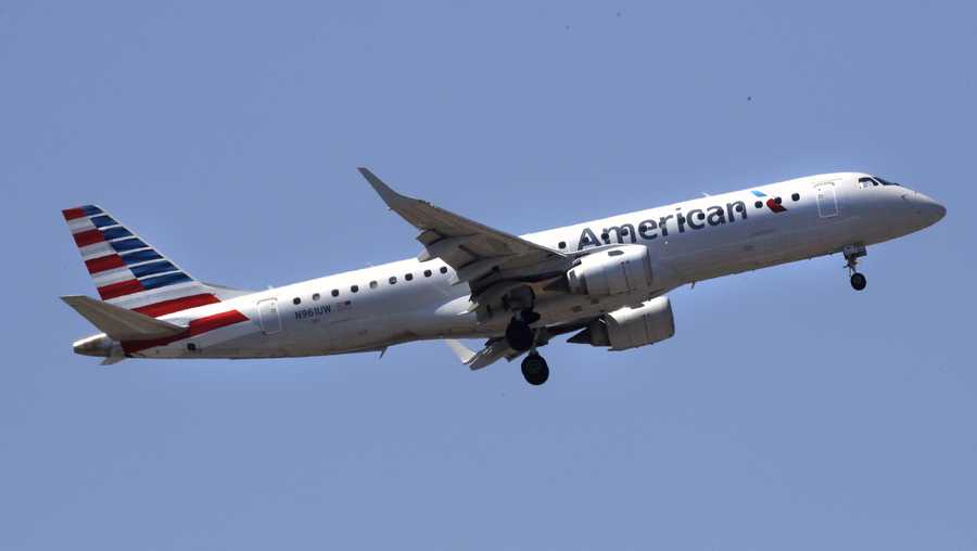 An American Airlines passenger jet plane, a Embraer ERJ-190 model, approaches Logan Airport in Boston, Thursday, May 24, 2018. (AP Photo/Charles Krupa)