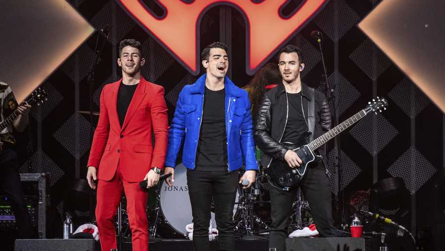 Nick Jonas, from left, Joe Jonas, and Kevin Jonas of The Jonas Brothers perform at Y100&apos;s Jingle Ball at BB&T Center on Sunday, Dec. 22, 2019, in Sunrise, Fla. (Photo by Amy Harris/Invision/AP)