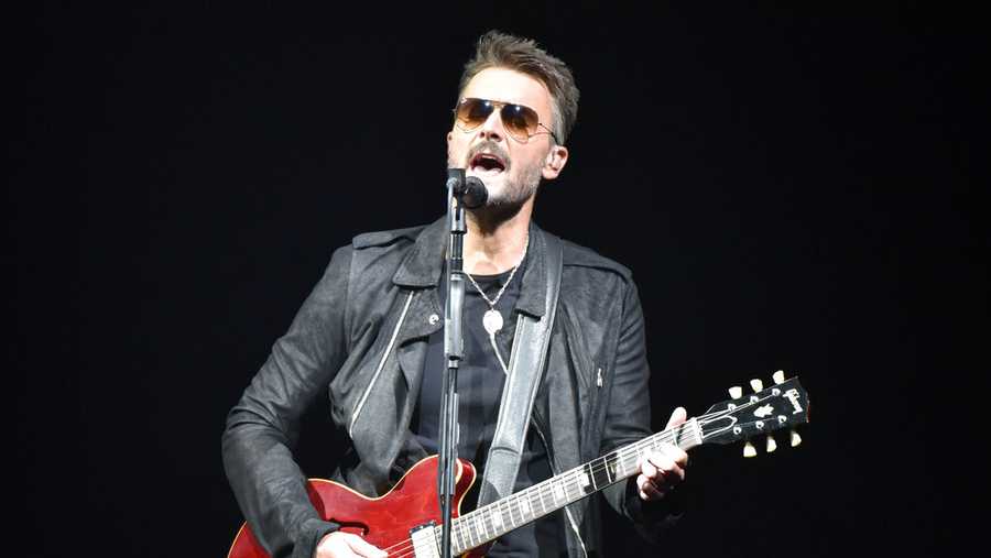 FILE - In this March 23, 2019 file photo, Eric Church performs during his Double Down tour in Rosemont, Ill. The country singer sent a message to fans in a new video that offers his belief in American resolve to overcome the pandemic. He is teasing new music, including a song called “Through My Ray Bans” from a forthcoming album.  (Photo by Rob Grabowski/Invision/AP, File)