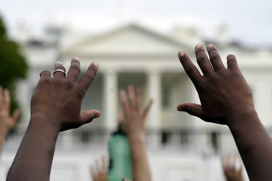 Demonstrators gather Friday across from the White House to protest the death of George Floyd.
