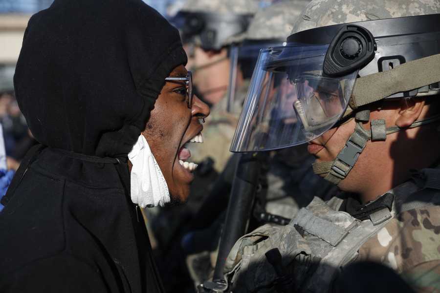 A protester yells at a member of the Minnesota National Guard Friday, May 29, 2020, in Minneapolis. Protests continued following the death of George Floyd.