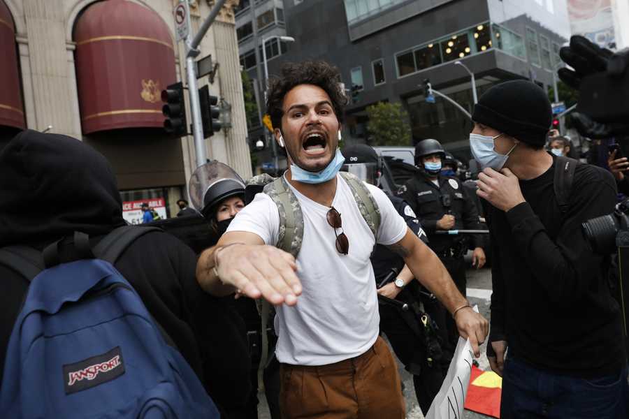 A man urges protesters not to get violent during a protest over the death of George Floyd on Friday in Los Angeles. (AP Photo/Jae C. Hong)