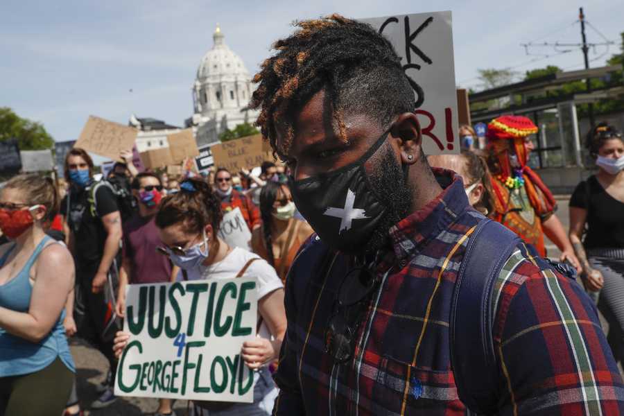 Protesters march away from the Minnesota State Capitol, Sunday, May 31, 2020, in St. Paul, Minn.