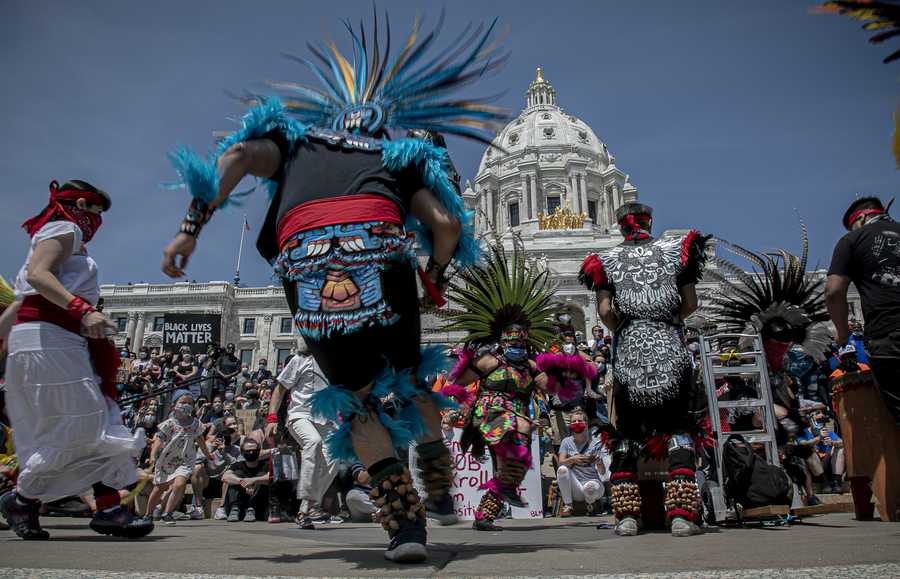 Mexica Aztec dancers perform a tribute dance for George Floyd during a rally at the Minnesota state Capital on Sunday May 31, 2020, in St. Paul, Minn. Protests were held in U.S. cities over the death of Floyd, a black man who died after being restrained by Minneapolis police officers on May 25. (AP Photo/Bebeto Matthews)