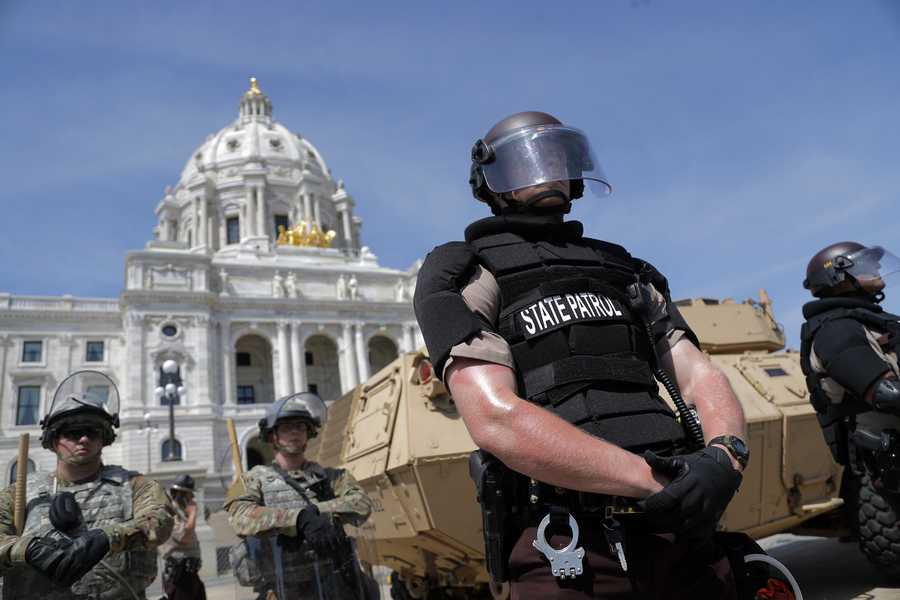 National Guard and state police guard the Minnesota statehouse Sunday, May 31, 2020, in St Paul, Minn. Protests continued following the death of George Floyd, who died after being restrained by Minneapolis police officers on May 25. (AP Photo/Julio Cortez)