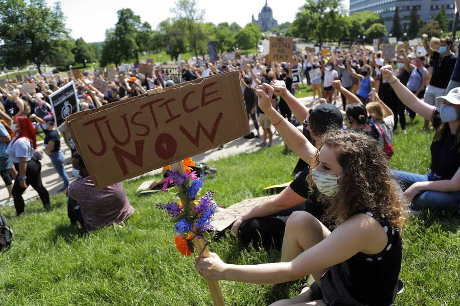 People rally at the Minnesota statehouse Sunday, May 31, 2020, in St. Paul, Minn. Protests continued following the death of George Floyd, who died after being restrained by Minneapolis police officers on Memorial Day. (AP Photo/Julio Cortez)