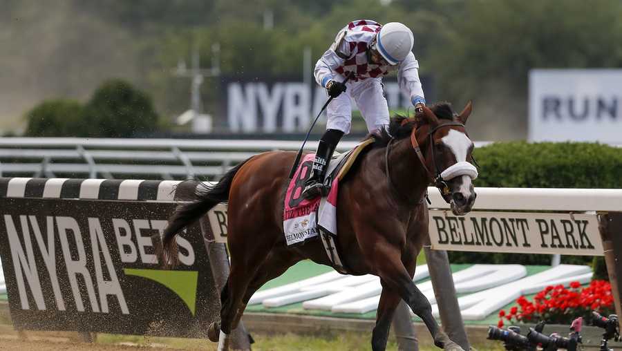 Tiz the Law (8), with jockey Manny Franco up, crosses the finish line to win the152nd running of the Belmont Stakes horse race, Saturday, June 20, 2020, in Elmont, N.Y.