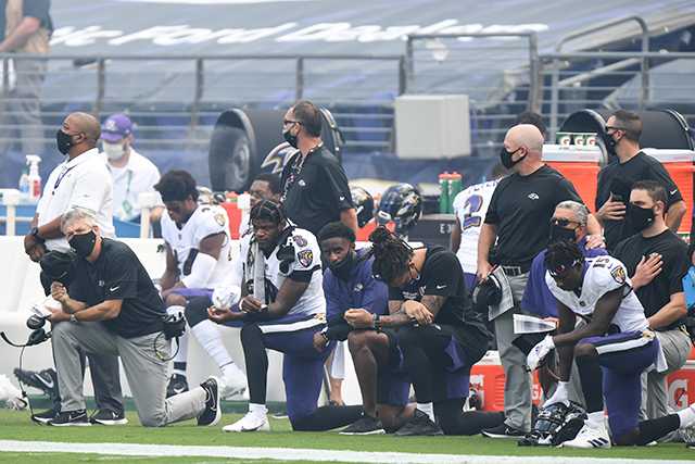 Lamar Jackson, Ravens QB and NFL MVP, kneels for national anthem