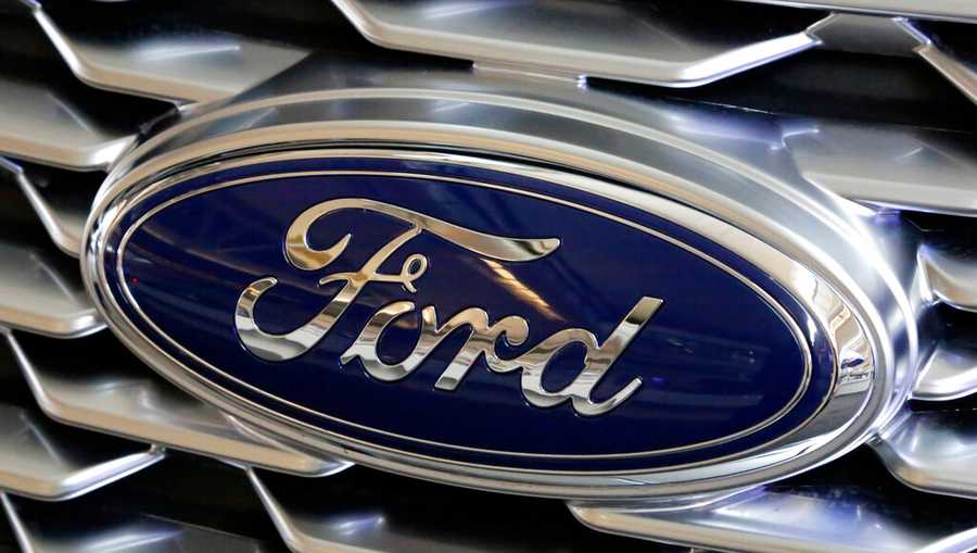 This Feb. 15, 2018, file photo shows a Ford logo on display at the Pittsburgh Auto Show. (AP Photo/Gene J. Puskar, File)