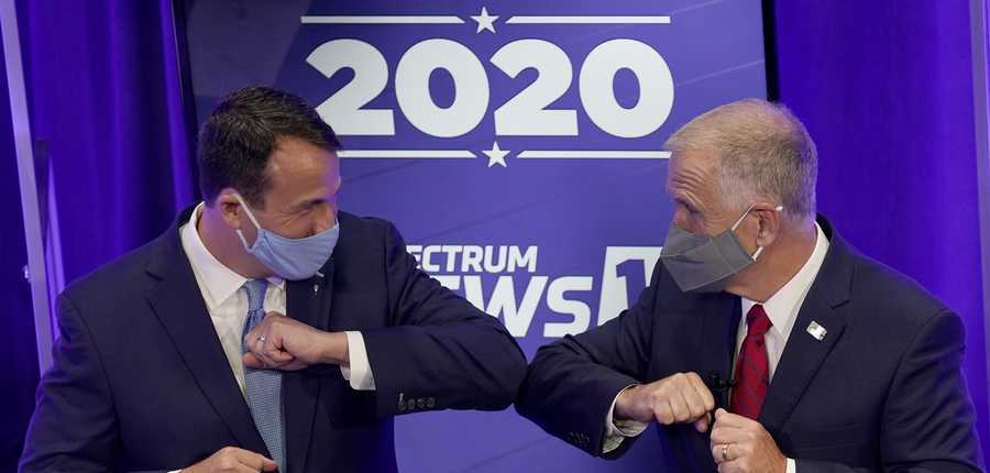Democratic challenger Cal Cunningham, left, and U.S. Sen. Thom Tillis, R-N.C. greet each other after a televised debate Thursday, Oct. 1, 2020, in Raleigh, N.C.