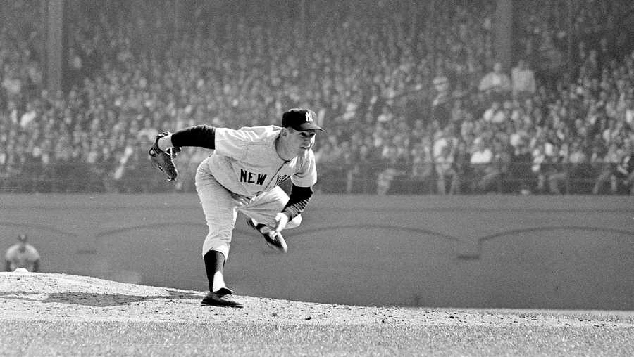 In this Oct. 12, 1960 file photo, New York Yankees pitcher Whitey Ford throws during the 6th game of the World Series against the Pittsburgh Pirates in Pittsburgh.