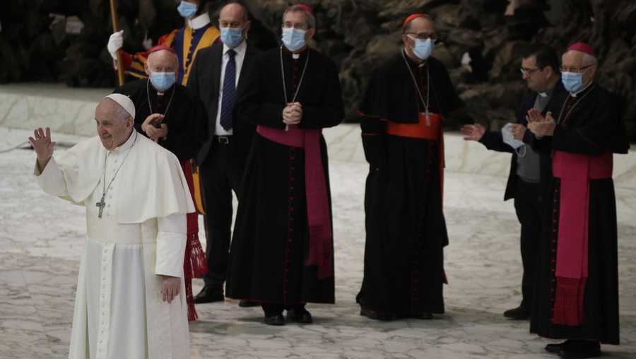 Pope Francis waves to faithful at the end of the weekly general audience in the Paul VI hall at the Vatican, Wednesday, Oct. 21, 2020. (AP Photo/Gregorio Borgia)