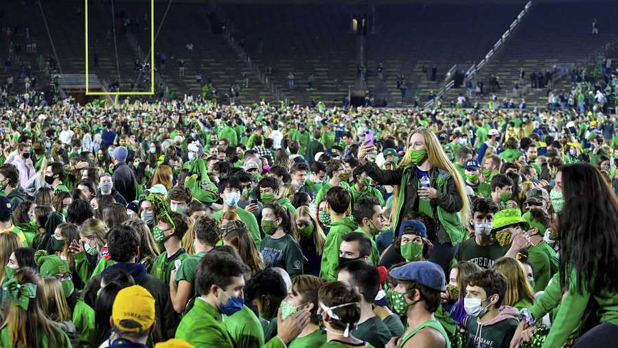 Fans storm the field after Notre Dame defeated Clemson Saturday, Nov. 7, 2020, in South Bend, Ind.