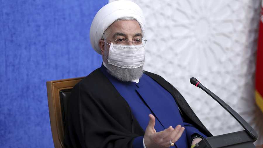In this photo released by the official website of the office of the Iranian Presidency, President Hassan Rouhani speaks in a meeting in Tehran, Iran, Sunday, Nov. 8, 2020.