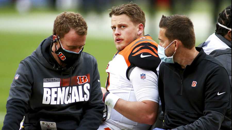 Cincinnati Bengals quarterback Joe Burrow (9) gets knocked out of the game with an injury during an NFL football game against the Washington Football Team, Sunday, Nov. 22, 2020 in Landover, Md. (AP Photo/Daniel Kucin Jr.)