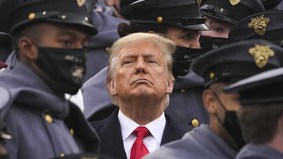 Surrounded by Army cadets, President Donald Trump watches the first half of the 121st Army-Navy Football Game in Michie Stadium at the United States Military Academy, Saturday, Dec. 12, 2020, in West Point, N.Y.