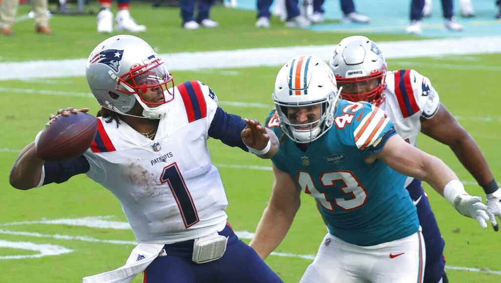 Miami Dolphins quarterback Tua Tagovailoa (1) watches a replay