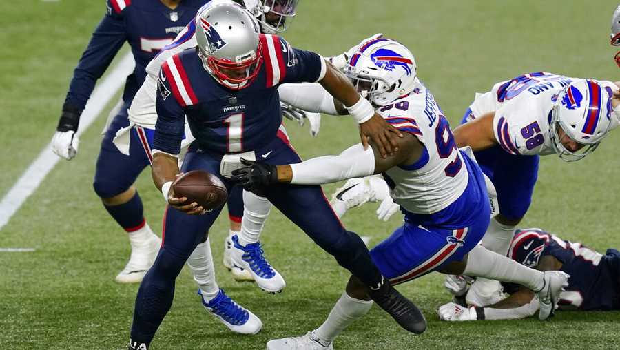 Buffalo Bills defensive tackle Quinton Jefferson, right, sacks New England Patriots quarterback Cam Newton (1) in the first half of an NFL football game, Monday, Dec. 28, 2020, in Foxborough, Mass. (AP Photo/Elise Amendola)